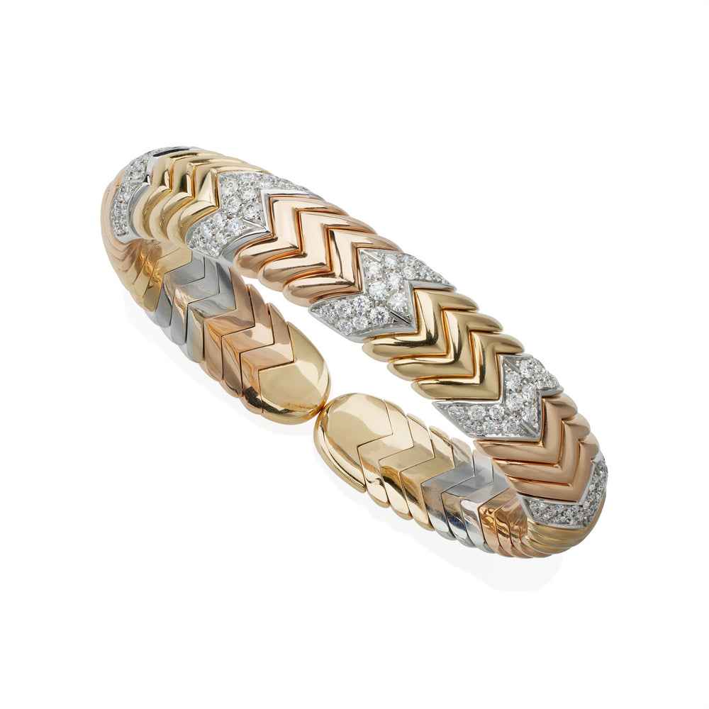 
                      
                        Macklowe Gallery Bulgari Tri-color Gold and Diamond "Spiga" Bangle Bracelet
                      
                    